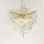 Brass-finish deep crystal branch cascade chandelier with the complete fixture visible
