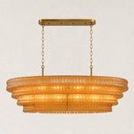 Amber fluted glass linear chandelier with stepped tiers