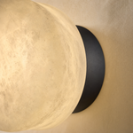 Luna Disc Medium Orb Alabaster Black Wall Sconce by Dalmivik, product or room detail view