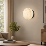 Luna Disc Medium Orb Alabaster Black Wall Sconce by Dalmivik, product or room detail view