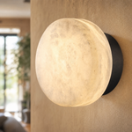Luna Disc Medium Orb Alabaster Black Wall Sconce by Dalmivik, product or room detail view