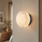 Luna Disc Medium Orb Alabaster Black Wall Sconce by Dalmivik, product or room detail view