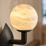 Sculpted Form Orb & Leaf Alabaster Wall Sconce by Dalmivik, product or room detail view