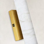 Unlit cylinder and vented brass-tone backplate close-up.