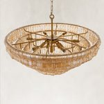 Amber fluted-glass round chandelier viewed from above.