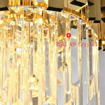 Close-up of illuminated crystal rods beneath a gold-tone metal crown.