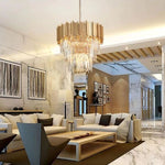 Crystal crown chandelier above a seating area in a furnished interior.