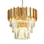 Illuminated crystal crown chandelier against a white background.