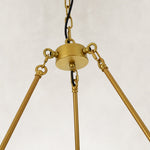 Candle ring chandelier, suspension hub and open support rods viewed from below.