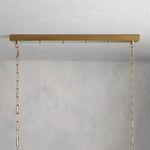 Wide brass-tone canopy with chain suspension details.