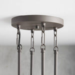 Black circular ceiling canopy with chain and rod attachments.