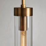 Close-up of the pendant's brass-tone cap and clear glass shade.