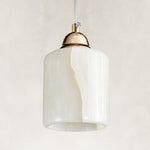 Cloud Onyx Cylinder Pendant shown unlit from two complete fixture angles