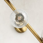 Brass-Tone Three-Globe Wall Sconce brass-tone fixture detail