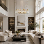 Brass crystal-bar drum chandelier in a double-height living room.