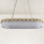 Unlit gold-tone chandelier with textured clear panels.
