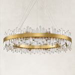 Unlit round chandelier with a gold-tone band and clear faceted rods.