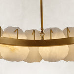 Illuminated gold-tone ring chandelier, inner band and central rod connection.