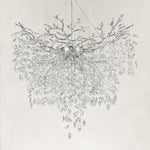 Unlit silver-finish crystal branch chandelier with a deep cascade of drops