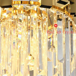 Close-up of illuminated crystal rods beneath a gold-tone metal crown.
