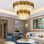 Double-crown crystal chandelier above a coffee table and seating area.