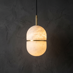 Ellune Alabaster Pendant Light by Dalmivik, complete fixture illuminated