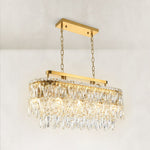 Three-quarter view of the crystal tiers and brushed gold linear frame