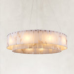 Illuminated layered alabaster ring chandelier with gold-tone hardware.