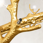 Gold-tone branch and socket close view