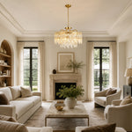 Gold-tone crystal chandelier shown in a living room with fireplace