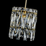 Gold-tone crystal pendant light, crystal shade on dark background