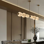 Handcrafted Alabaster Pebble Linear Chandelier – Gold & White LED by Dalmivik, product or room detail view