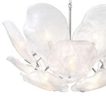 Close-up of white glass petals and silver-tone frame details.