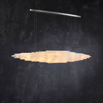 Angled illuminated selenite linear pendant with a silver-tone canopy.