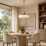 Low-Profile Marble Drum Pendant installed above a dining table
