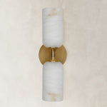 brass-tone twin-cylinder wall sconce shown unlit.
