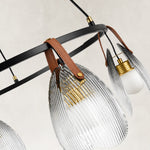 Ring chandelier with ribbed glass shades, hanger and ring junction.