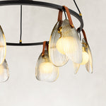 Ring chandelier with ribbed glass shades, ribbed glass shade and brown hanger.