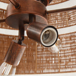 Natural woven drum chandelier fixture detail.