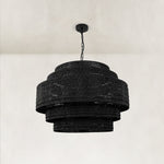 Black woven drum chandelier fixture detail.