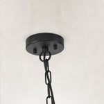 Black woven drum chandelier fixture detail.