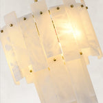 Illuminated white-panel fixture detail with gold-tone fixing heads.
