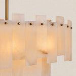 Illuminated white-panel and gold-tone fastener detail.