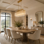 Gold-tone oval crystal chandelier, coffered-ceiling dining room.