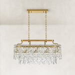 Gold-tone oval crystal chandelier, complete unlit frontal fixture.