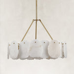 Unlit brass-tone round petal chandelier.