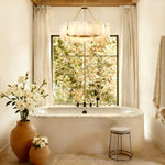 Petal Round LED Chandelier, 24 in in brass finish, shown above a bathtub