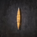 Selenite wall sconce shown from an angle against a dark background.