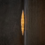 Side profile of the slender selenite wall sconce.