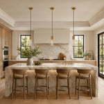 Brass ringed ribbed glass mini pendants over a kitchen island
